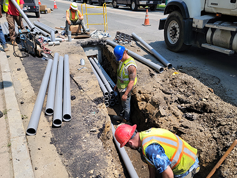Installing (11) 4 inch ducts and (4) 1.25 inch ducts between HEX manholes C19BA-202 and relocated C19BA-203.