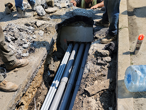 Mating of (11) 4 inch ducts and (4) 1.25 ducts from previously completed trench section to the newly relocated and replaced HEX manhole C19BA-203.